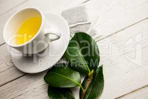 Cup of herbal tea on table