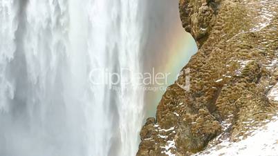 Waterfall Seljalandsfoss with rainbow in Iceland