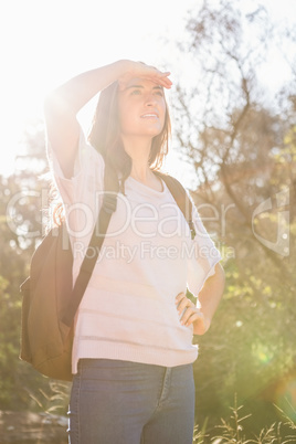 Pretty brunette hiker looking for path
