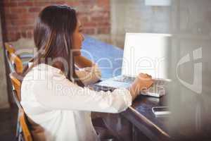 Beautiful businesswoman reading a book