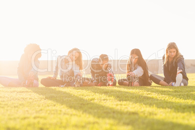 Sporty women stretching during fitness class