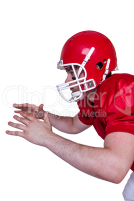 American football player about to catch a ball