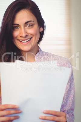 Pretty brunette reading documents