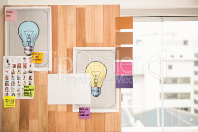 Illustrations and sticky notes on wooden wall