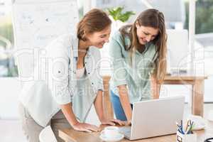 Casual businesswomen working with laptop