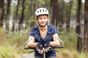 Young pretty happy biker looking at camera