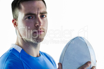 Rugby player holding a rugby ball Rugby player holding a rugby ball