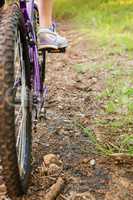 Close up view of woman pedaling on mountain bike