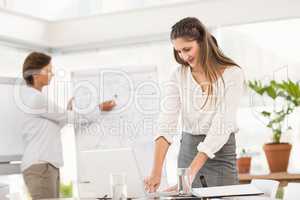 Smiling businesswoman preparing meeting