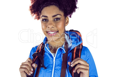 Close up view of a young woman with camera and backpack