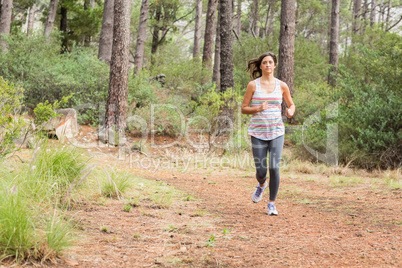 Young happy jogger walking