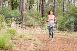 Young happy jogger walking