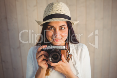 Pretty hipster using her vintage camera