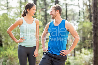 Happy joggers looking at each other