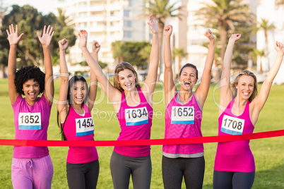 Cheering women supporting breast cancer marathon