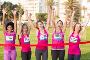 Cheering women supporting breast cancer marathon