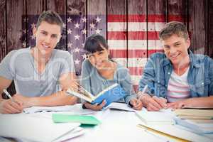 Composite image of students doing work together as they all look