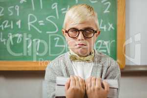 Pupil dressed up as teacher holding books