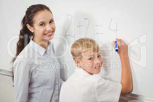 Teacher helping a student in class