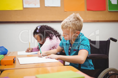 Smiling student sitting in wheelchair