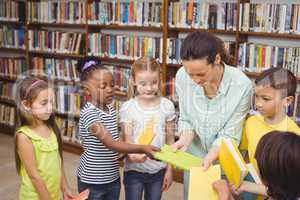 Pupils and teacher in the library