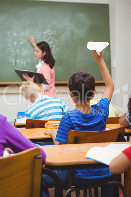 Student about to throw a paper airplane