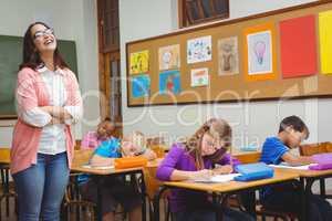 Teacher standing by her students