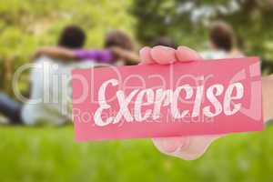 Exercise against children sitting with arms around at park