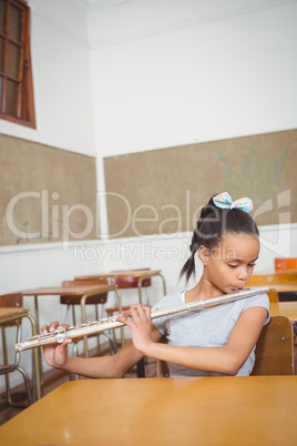 Student using a flute in class