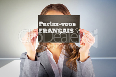 Composite image of businesswoman showing card