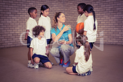 Teacher talking with sports students