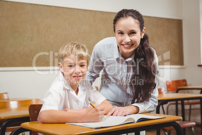 Teacher helping a student in class