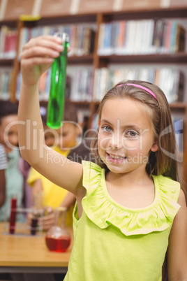 Pupil doing science in library