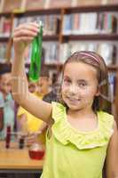 Pupil doing science in library