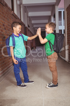 Pupils giving each other a high five