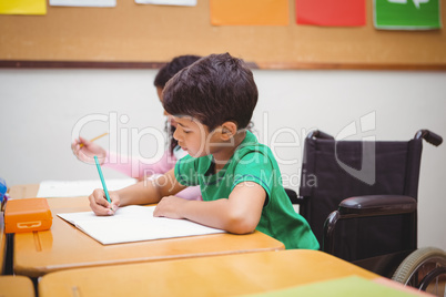 Smiling student sitting in wheelchair