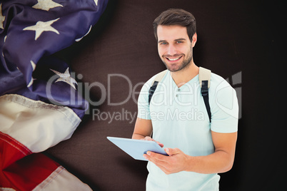 Composite image of student using tablet pc