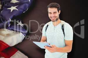 Composite image of student using tablet pc