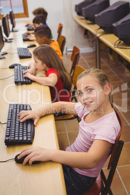 Smiling student using a computer