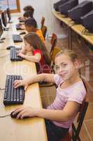 Smiling student using a computer