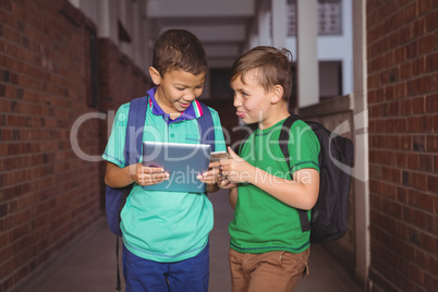 Students using a tablet and smart phone