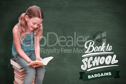 Composite image of cute little girl reading book in library