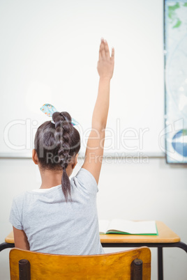 Students raising hands to answer a question