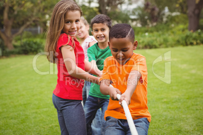Kids pulling a large rope