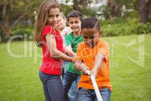 Kids pulling a large rope