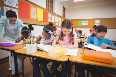 Pupils working at their desks in class