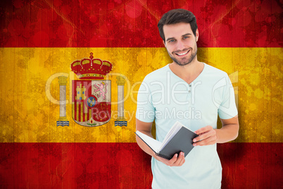 Composite image of student holding book