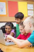 Pupils using a laptop in class