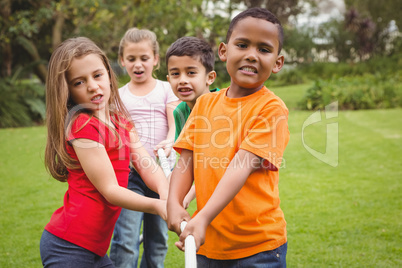 Kids pulling a large rope