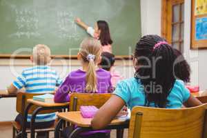 Teacher writing on the blackboard